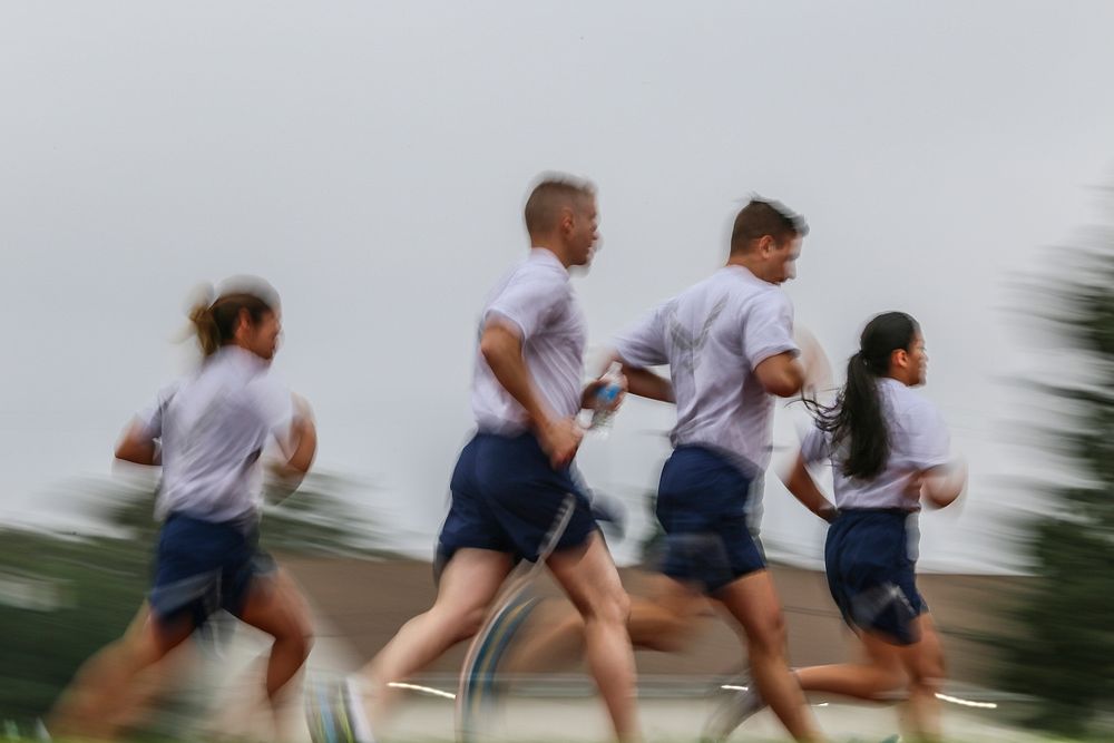 U.S. Air Force airmen compete in the 1,000 meter sprint portion of a German Armed Forces Badge for Military Proficiency test…