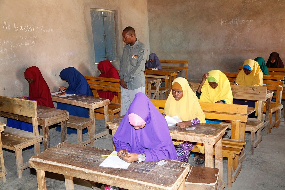 Students sit for their final term exam at Mujama Secondary School in Beledweyne, Somalia, on May 22, 2017. UN Photo.…