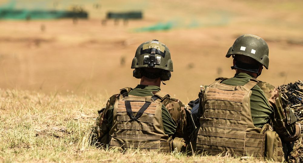 Slovenian soldiers overlook the live fire mission from their support by fire position during Exercise Noble Partner.…