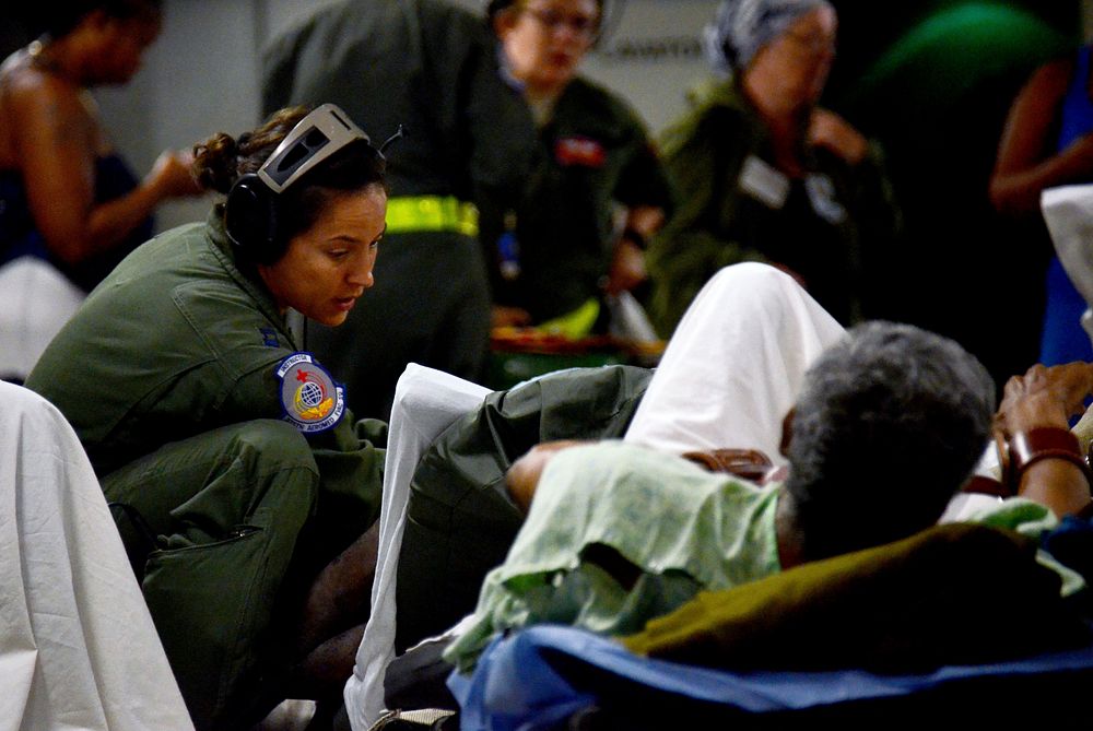 U.S. Air Force medical personnel aboard a C-17 Globemaster III aircraft assist Hurricane Maria patients evacuated from St.…