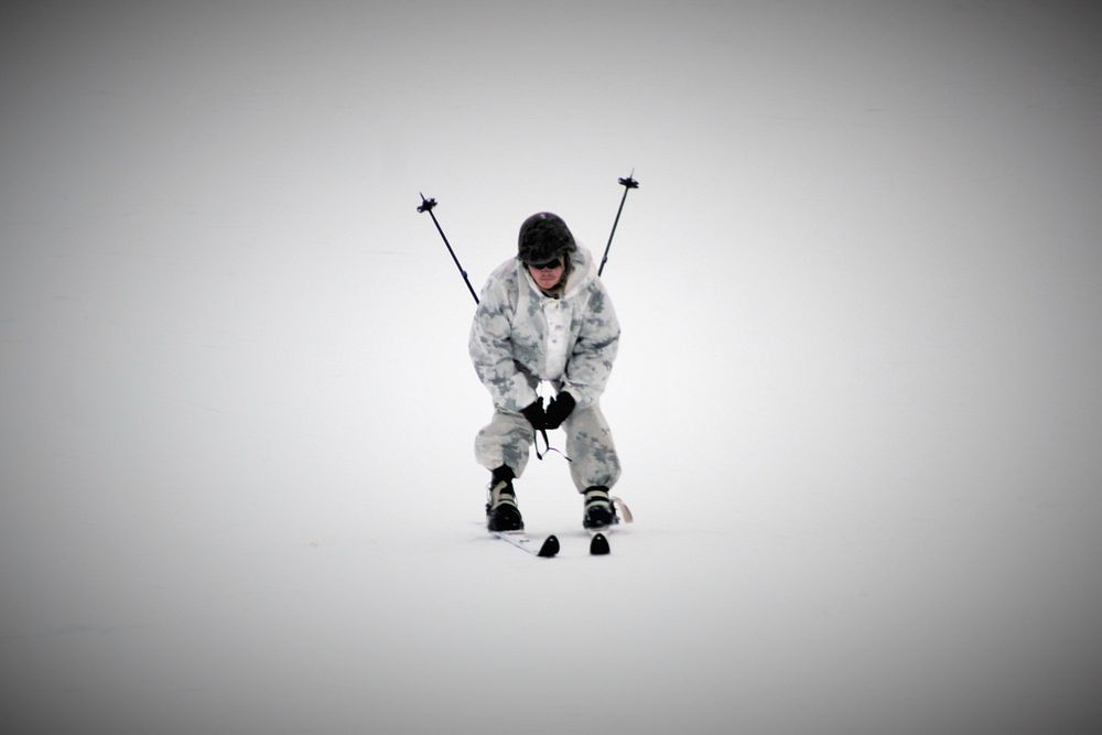 A student in the Fort McCoy Cold-Weather Operations Course Class 18-03 learns about skiing techniques Jan. 25, 2018, at…