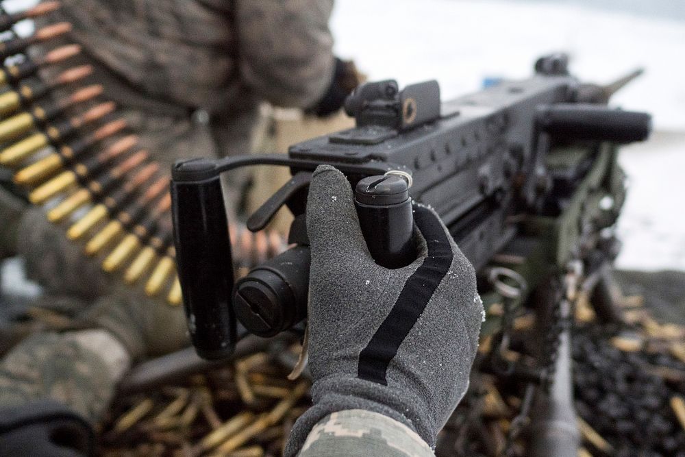 Airmen assigned to the 673d Security Forces Squadron load an M2 .50 Caliber machine gun during a qualification range on…