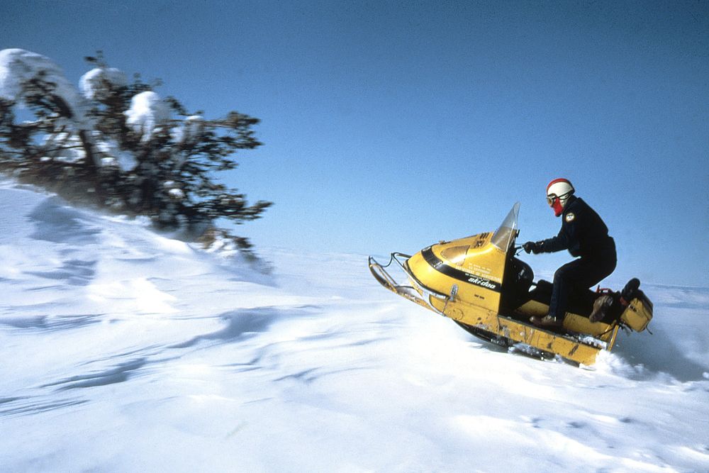 Person riding snowmobile. Original public domain image from Flickr