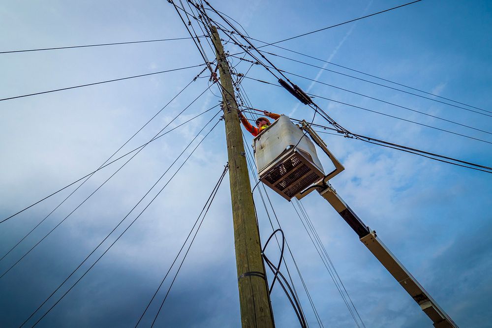 Groundman Chris Via secures lines for Virginia's BARC Electric Cooperative's efforts in installing fiber optic cables to the…