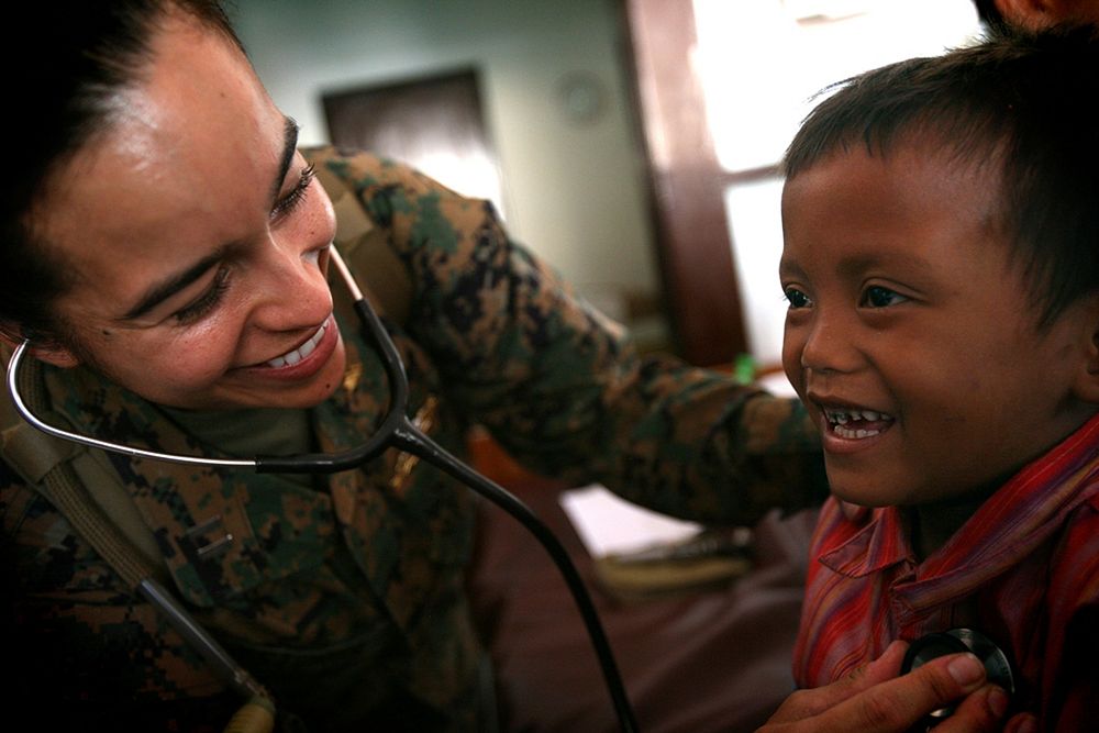 Navy Lt. Yesenia Astorga, from Los Angeles, and general medical officer with the 11th Marine Expeditionary Unit, checks the…