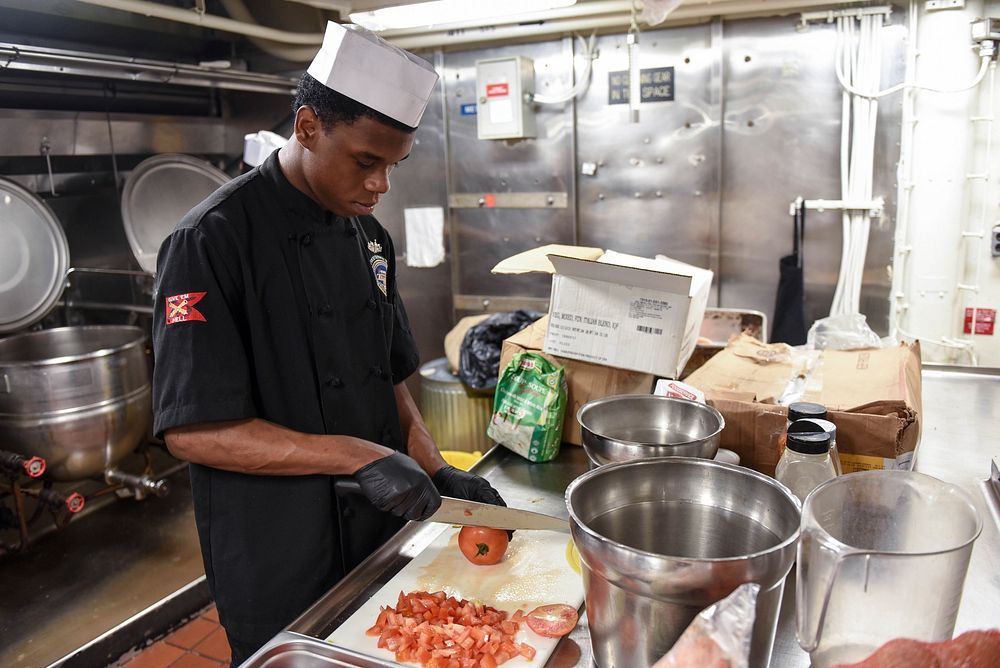 MEDITERRANEAN SEA (May 19, 2018) Culinary Specialist Seaman Bonnie Shanno prepares food in a galley aboard the Nimitz-class…