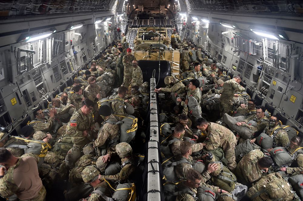 U.S. Army paratroopers assigned to the 2nd Brigade Combat Team, 82nd Airborne Division, stationed at Fort Bragg, N.C., load…