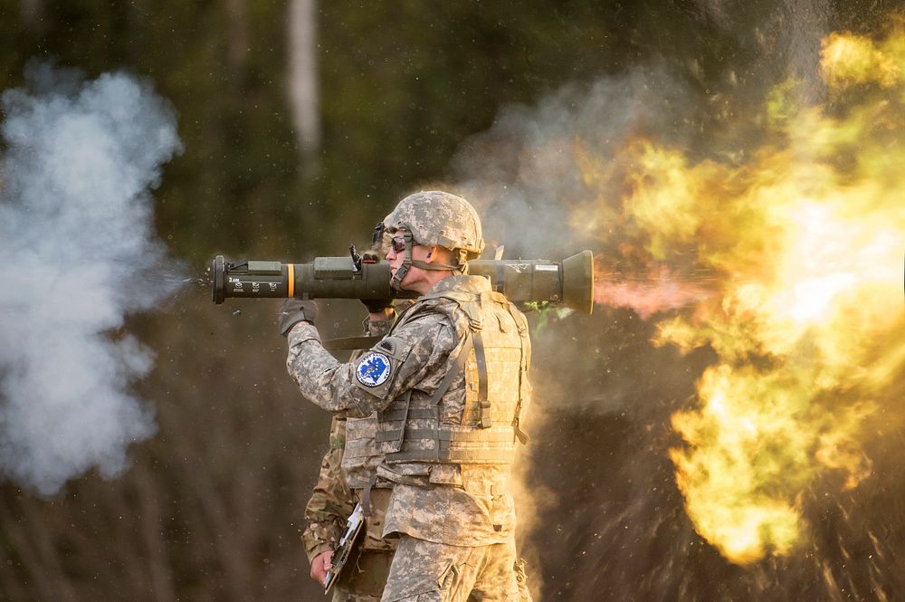 Oregon Army National Guard Spc. Michael Norris fires the M136E1 AT4-CS confined light anti-armor weapon while competing in…