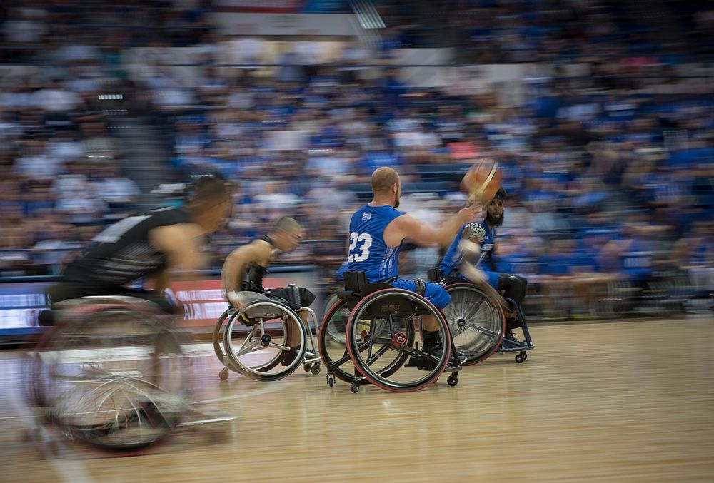 Russell Logan, a Department of Defense Warrior Games athlete and Team Air Force member, passes the ball to his teammate…
