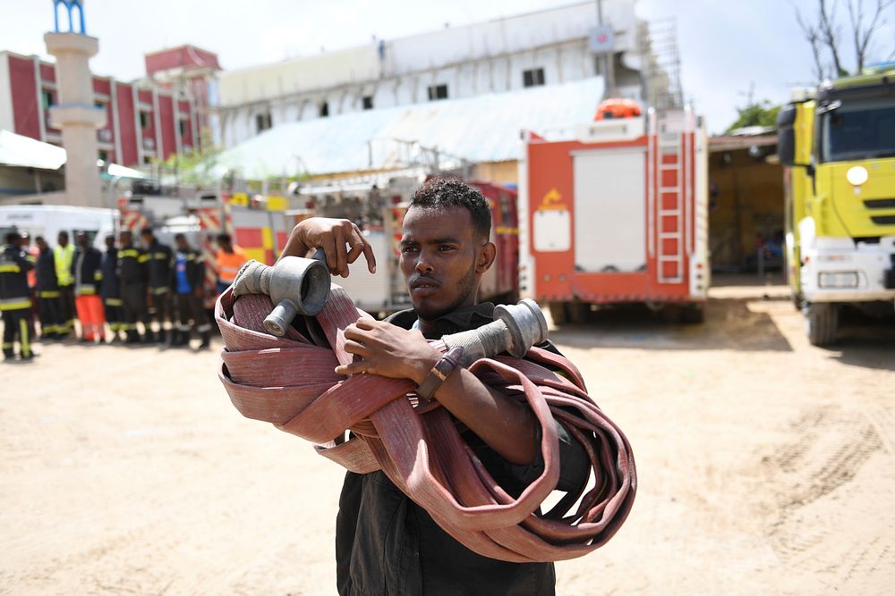 A member of the Mogadishu's Fire and Emergency Response Service serving under the Benadir Regional Administration holds a…