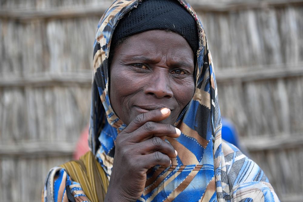 An elderly woman from Daifa village, located six kilometres from Jowhar in Middle Shabelle region witnesses the hand over to…