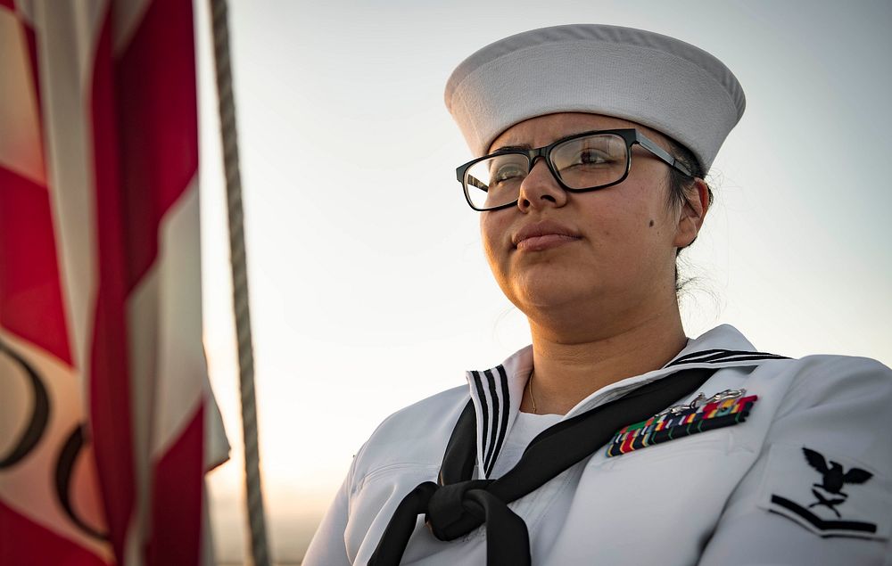 NAVAL STATION ROTA, SPAIN (July 27, 2018) Yeoman 3rd Class Gennesis Hernandez prepares to raise the American flag during…