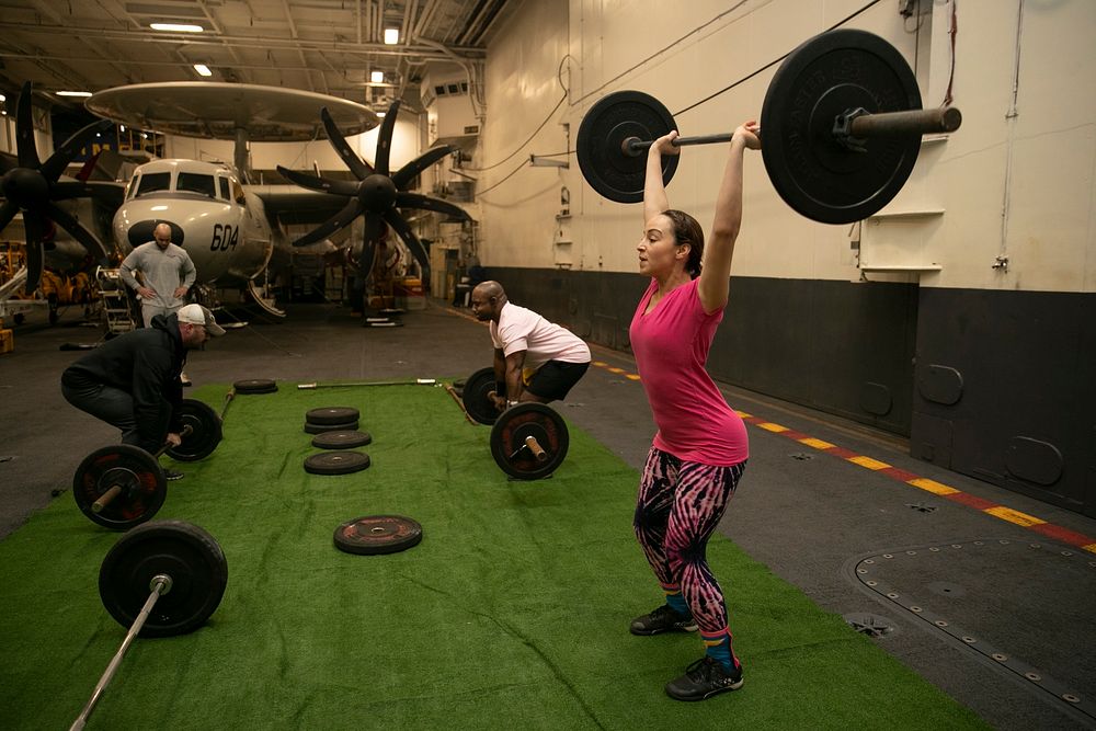 NORWEGIAN SEA (Oct. 28, 2018) Sailors participate in a breast cancer awareness event in the hangar bay aboard the Nimitz…