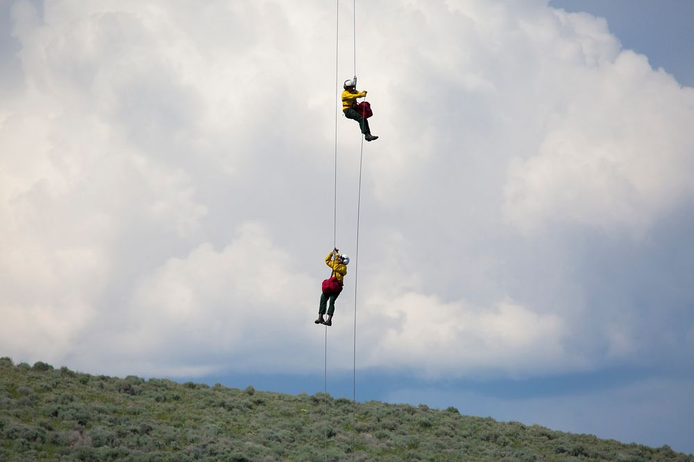 Wildland Firefighters on Rappel capable crews, come from all over the nation each spring to train at the National Helicopter…