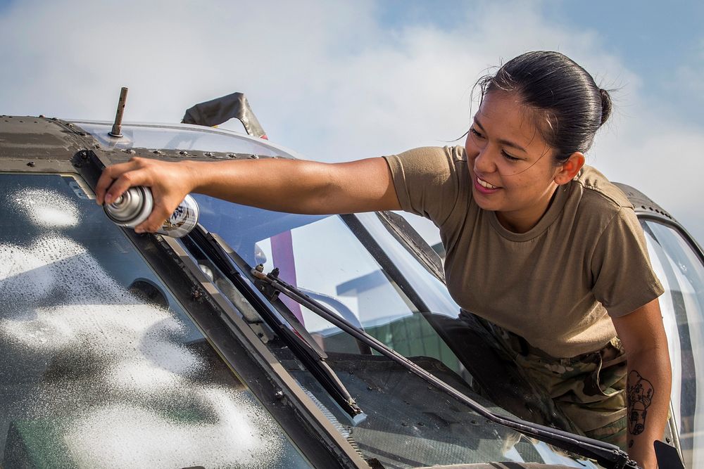 U.S. Army Spc. Mary Grace A. Oinal with the 1-150th Assault Helicopter Battalion, New Jersey Army National Guard, cleans the…