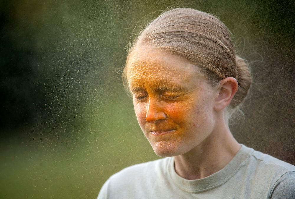 Airman 1st Class Anna Murphy, assigned to the 673d Security Forces Squadron, is sprayed with oleoresin capsicum (OC) while…