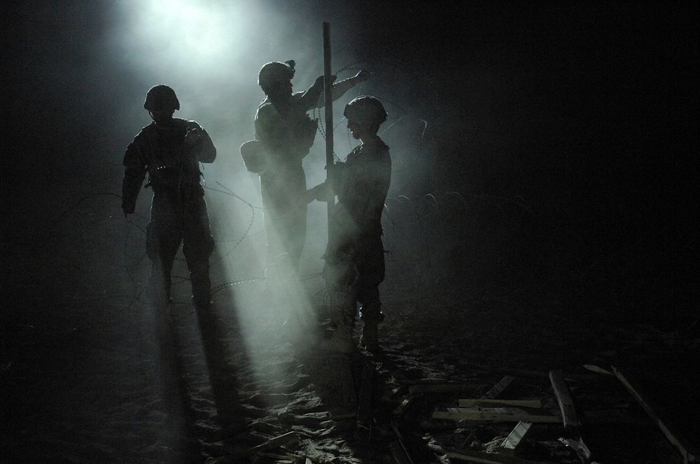 U.S. Soldiers with Bear Troop, 8th Squadron, 1st Cavalry Regiment fortify an Afghan Highway Police checkpoint by placing…