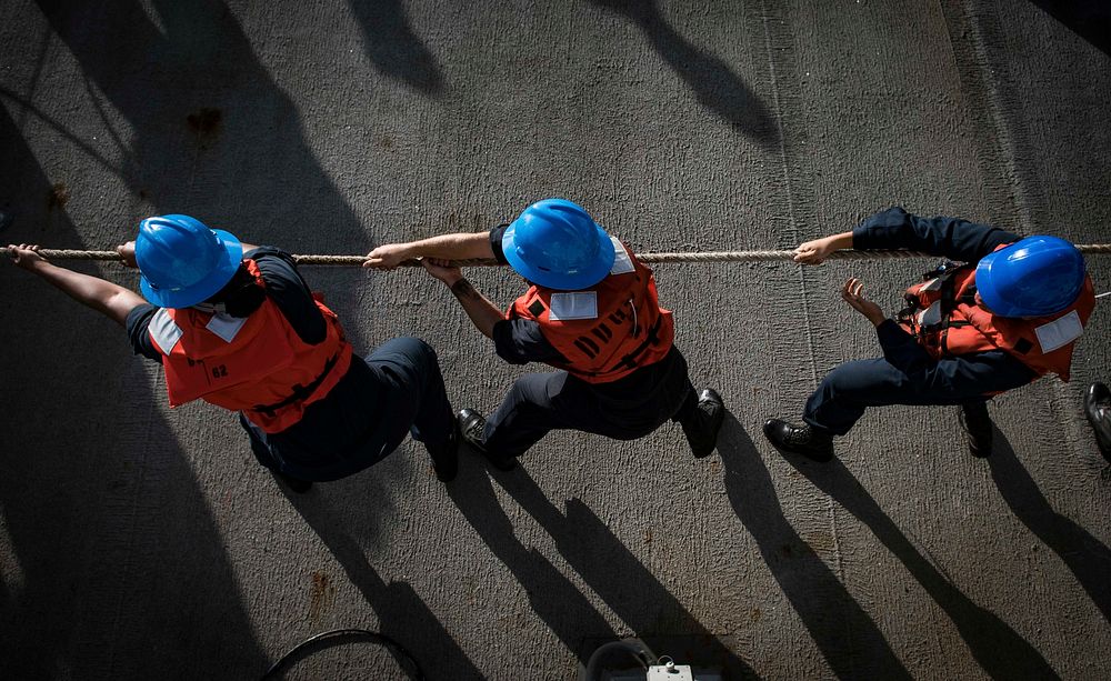 MEDITERRANEAN SEA. Sailors heave line during a man overboard drill aboard the Arleigh Burke-class guided-missile destroyer…