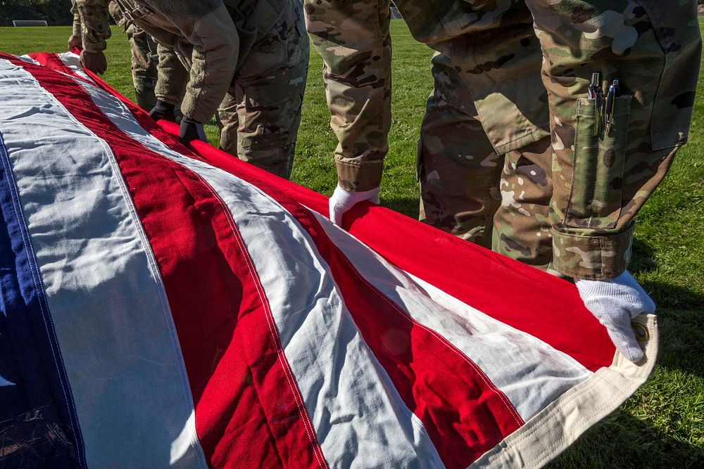 U.S. Army Soldiers with the New Jersey National Guard's Honor Guard prepare to lift the flag above the casket. Original…