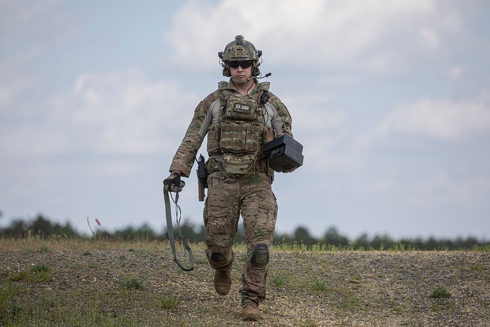 A special warfare airman with the New Jersey Air National Guard’s 227th Air Support Operations Squadron carries ammunition…