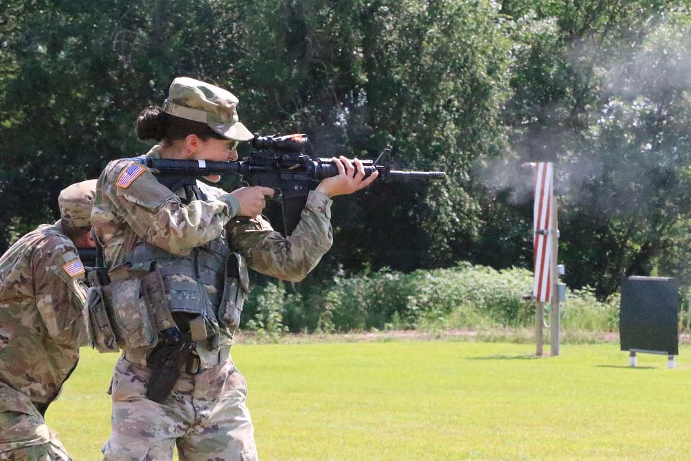 U.S. Army Spc. Micah Redenbaugh, a supply specialist assigned to the 170th Support Maintenance Company, fires at her target…