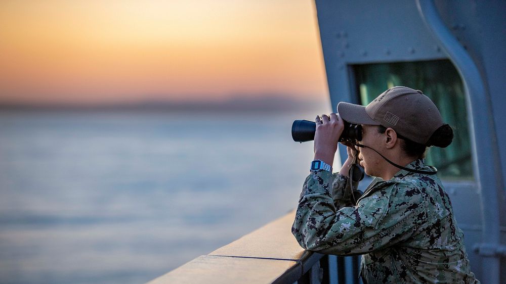 LISBON, Portugal (Oct. 21, 2019) Operations Specialist 2nd class Gabrielle Smith stands watch aboard the Blue Ridge-class…