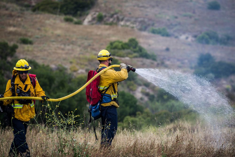 Firefighters with Orange County Fire Authority extinguish a prescribed fire as part of the annual Wildland Fire School on…