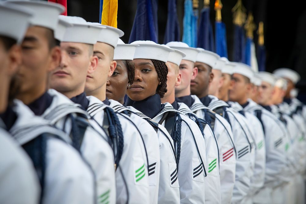 U.S. Sailors assigned to the U.S. Navy Ceremonial Guard wait to parade the colors during a Concert on the Avenue at the U.S.…