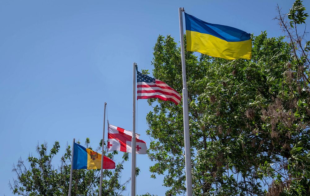 CHABANKA, Ukraine (July 1, 2019) — Ukrainian, U.S., Romanian and Georgian flags are flown after the Field Training Kickoff…