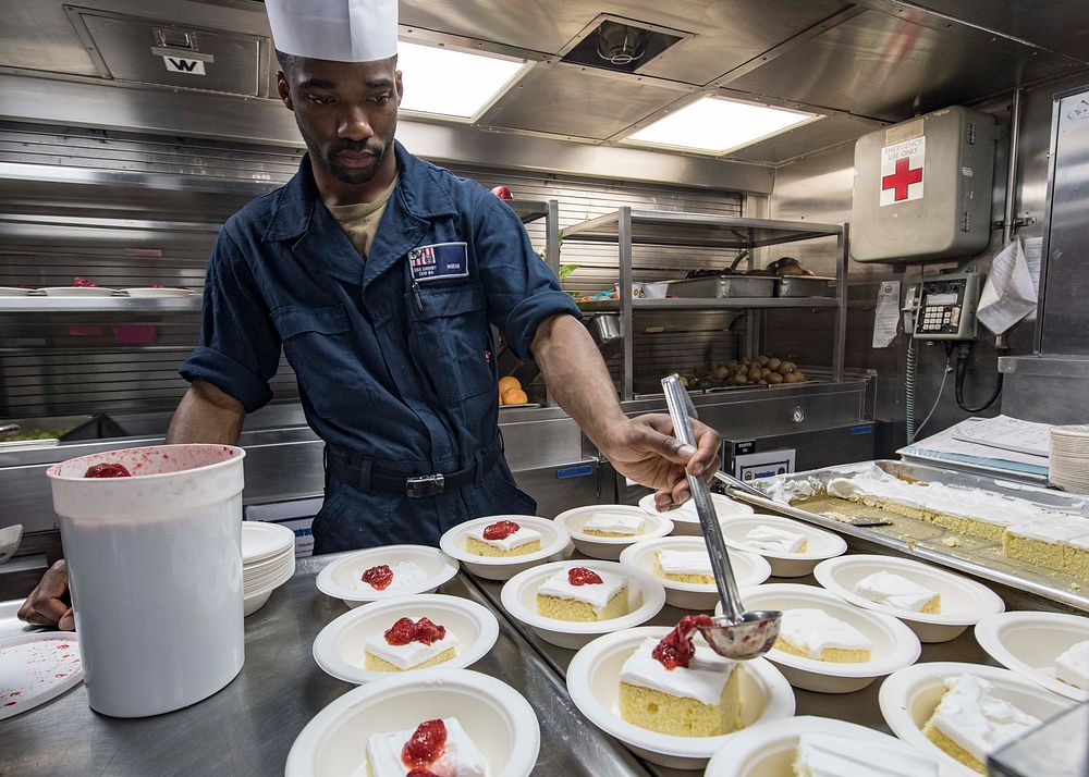 BLACK SEA (July 14, 2019) - Culinary Specialist Seaman Bevin Ingram, from Providence, Rhode Island, prepares desserts for…