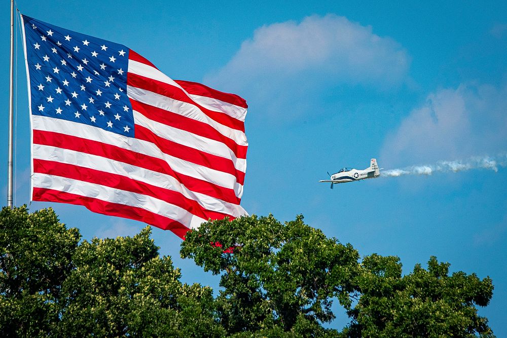 Aircraft fly overhead during the 2019 EAA AirVenture Oshkosh July 23, 2019, in Oshkosh, Wisconsin.