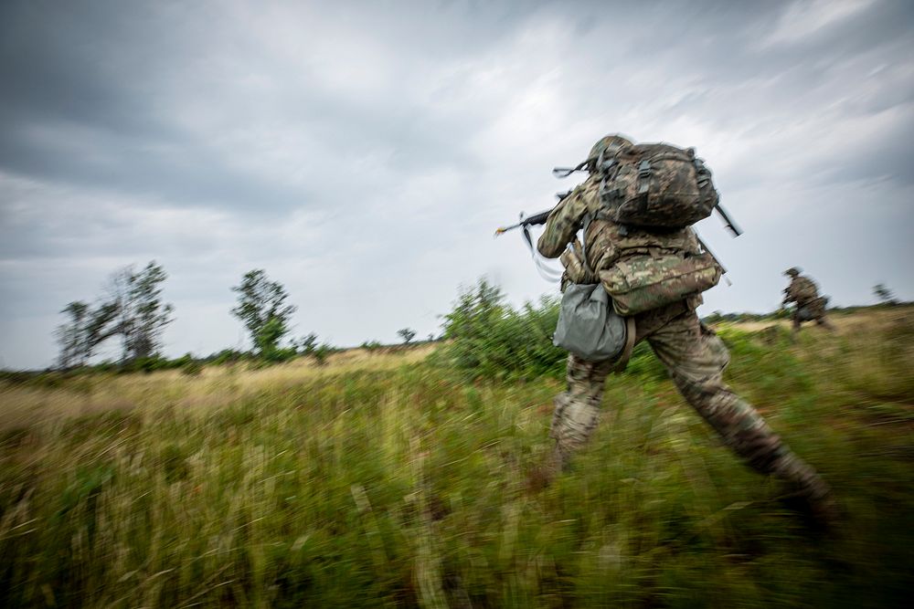 U.S. Army Soldiers with the Oklahoma National Guard’s C Company, 1-279th Infantry Regiment bound towards objectives during…