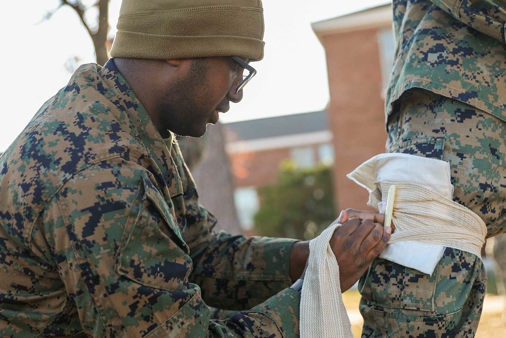 U.S. Navy Seaman Ian Ichungwa, a corpsman with the 22nd Marine Expeditionary Unit, demonstrates how to properly apply a…