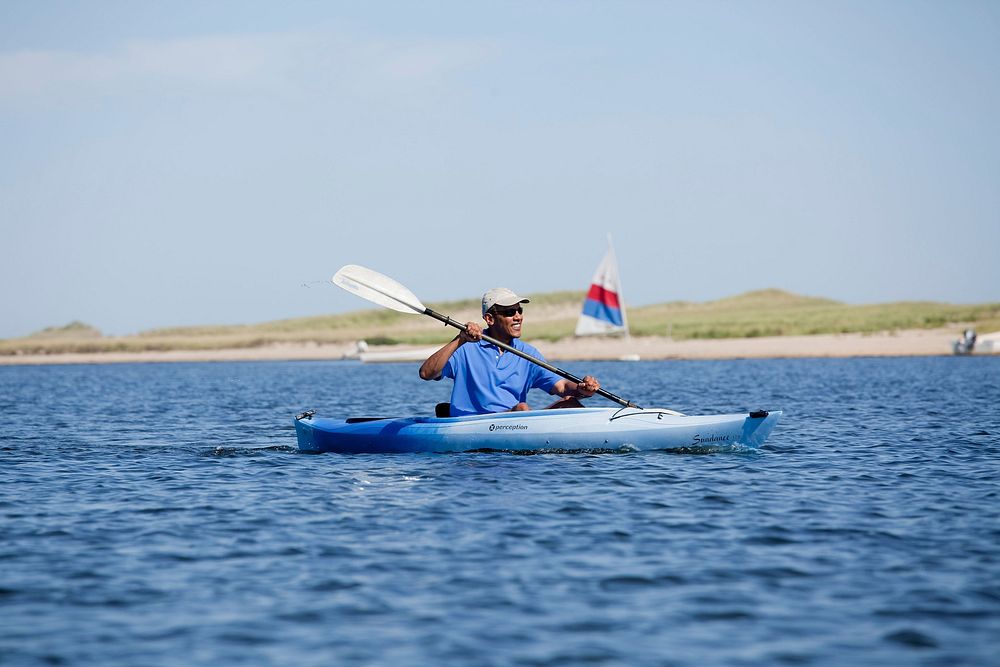 President Barack Obama kayaks while spending time with friends at a beach in Edgartown, Mass., Aug. 28, 2010.