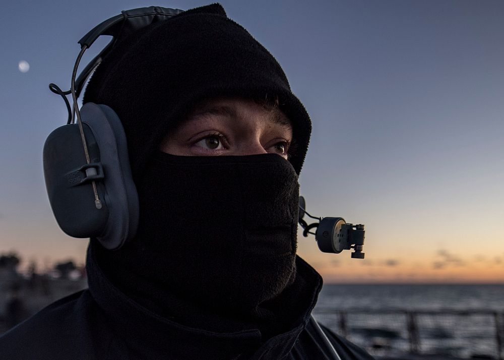 ATLANTIC OCEAN (Dec. 3, 2019) - Seaman Evan Veine, from Stevensville, Michigan, stands watch as the aft lookout aboard the…