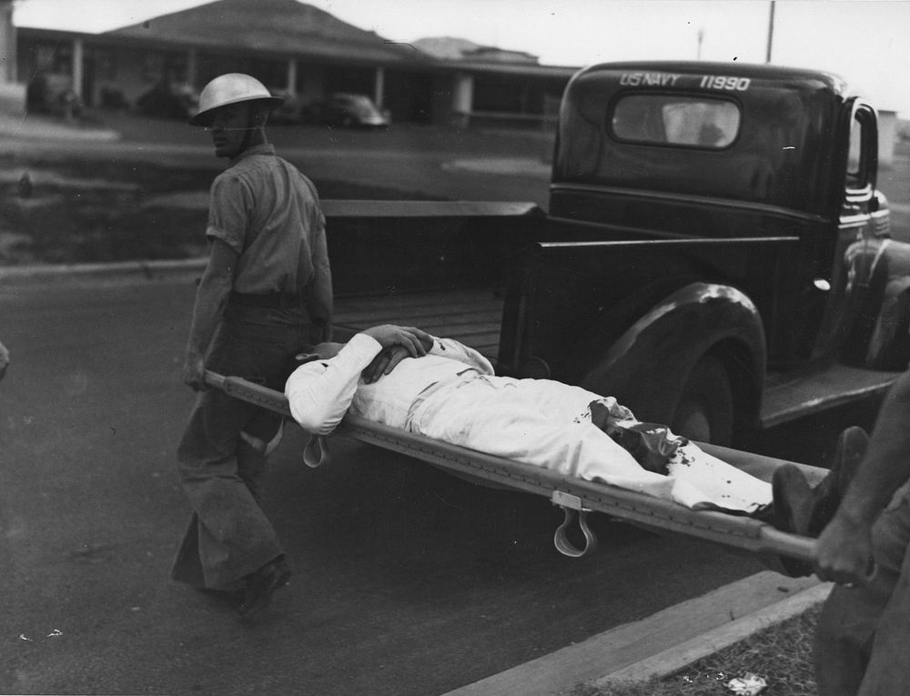 Sailor injured during Jap attack on Pearl Harbor is carried to safety. December 7, 1941. BUAER 77625 Navy Medicine…