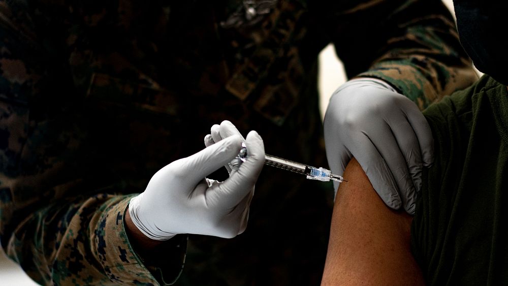 Deploying Marines and Sailors receive COVID-19 vaccine.