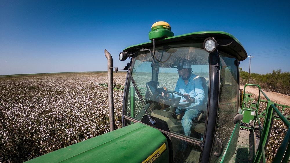 Schirmer Farms (Batesville) Operations Manager Brandon Schirmer, sprays defoliant on one of the fields at his father's multi…