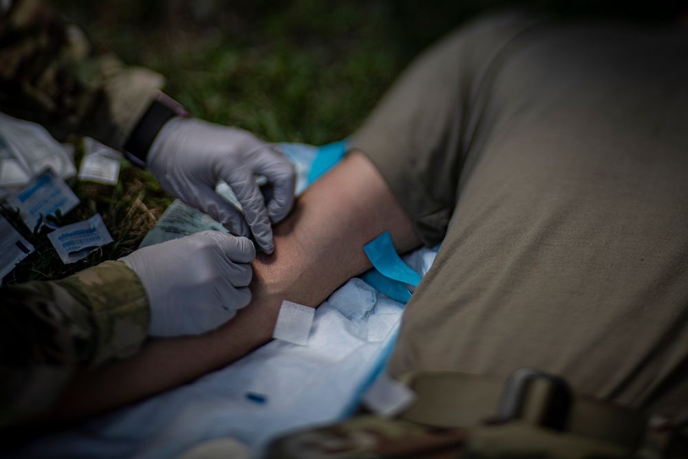 U.S. Army Spc. Alexandria Ramalho, a Combat Medic with the Rhode Island National Guard’s 126th Aviation Regiment inserts a…