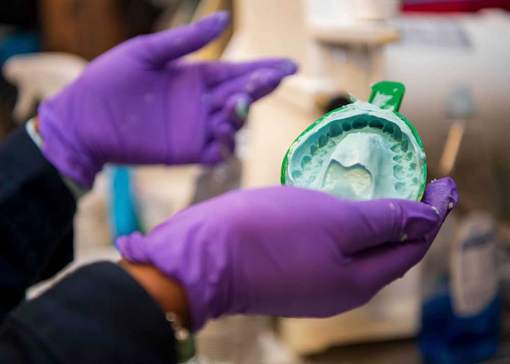 NEWPORT NEWS, Va. (Aug. 11, 2020) Hospital Corpsman 3rd Class Ellysse Tilley, assigned to the dental department aboard the…