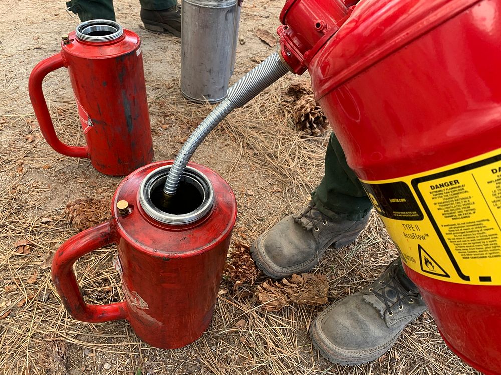 Bluff Mesa Rx Burn, May 2020Firefighters topping off their drip torches from a jerry can.Forest Service photo by Lisa Cox.…