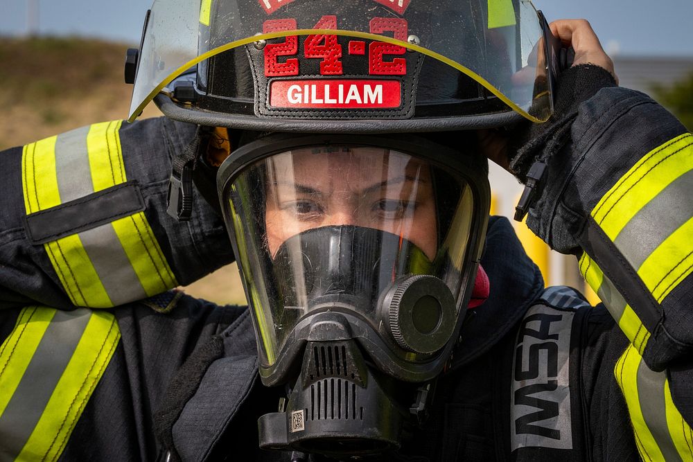 New Jersey state fire protection specialist Ashley Gilliam with the New Jersey Air National Guard's 177th Fighter Wing dons…