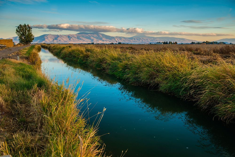 HDR image of an irrigation canal in Burley, Idaho, south of town. 10/8/2018 Photo by Kirsten Strough. Original public domain…