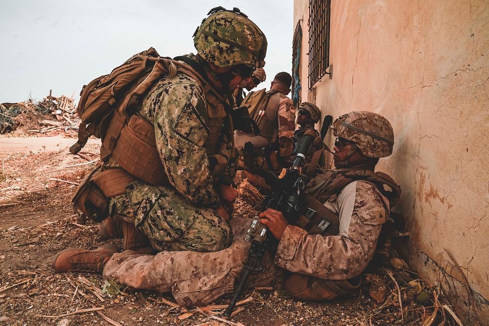 A U.S. Navy Corpsman with Commander, Task Force - 68 (CTF-68), conducts simulated casualty training on a U.S. Marine with…