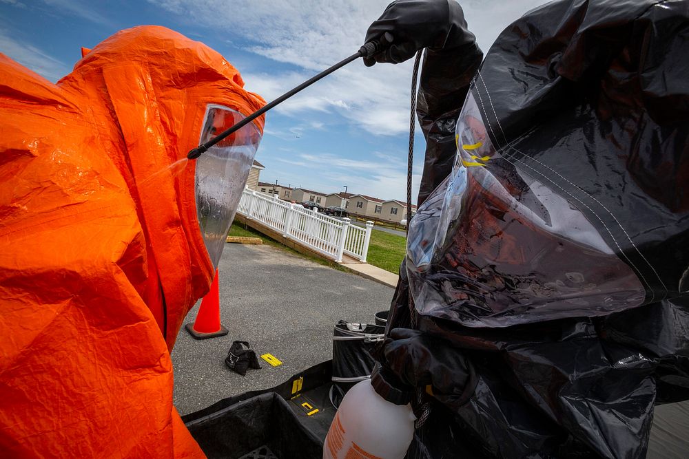 U.S. Army Staff Sgt. Nicky Lam, right, decontaminates Sgt. Eric J. Boyer, both survey team members with the 21st Weapons of…