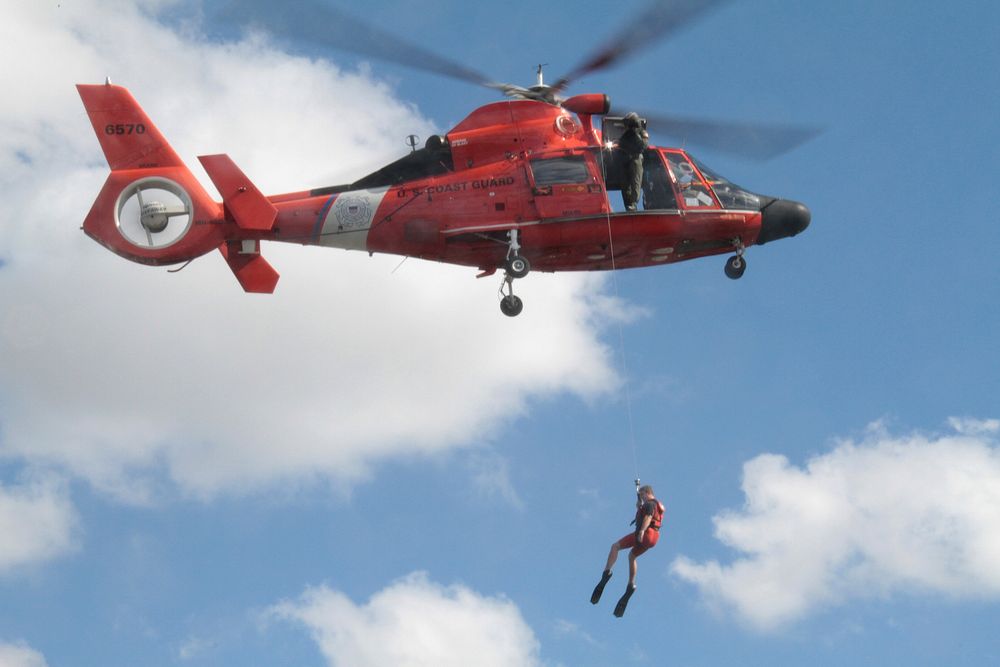 Members of the search and rescue team with Coast Guard Air Station Miami perform a rescue demonstration during a cookout for…