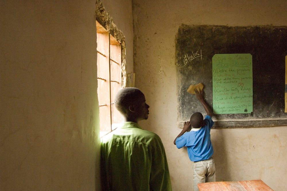 Two local boys in their classroom. Original public domain image from Flickr