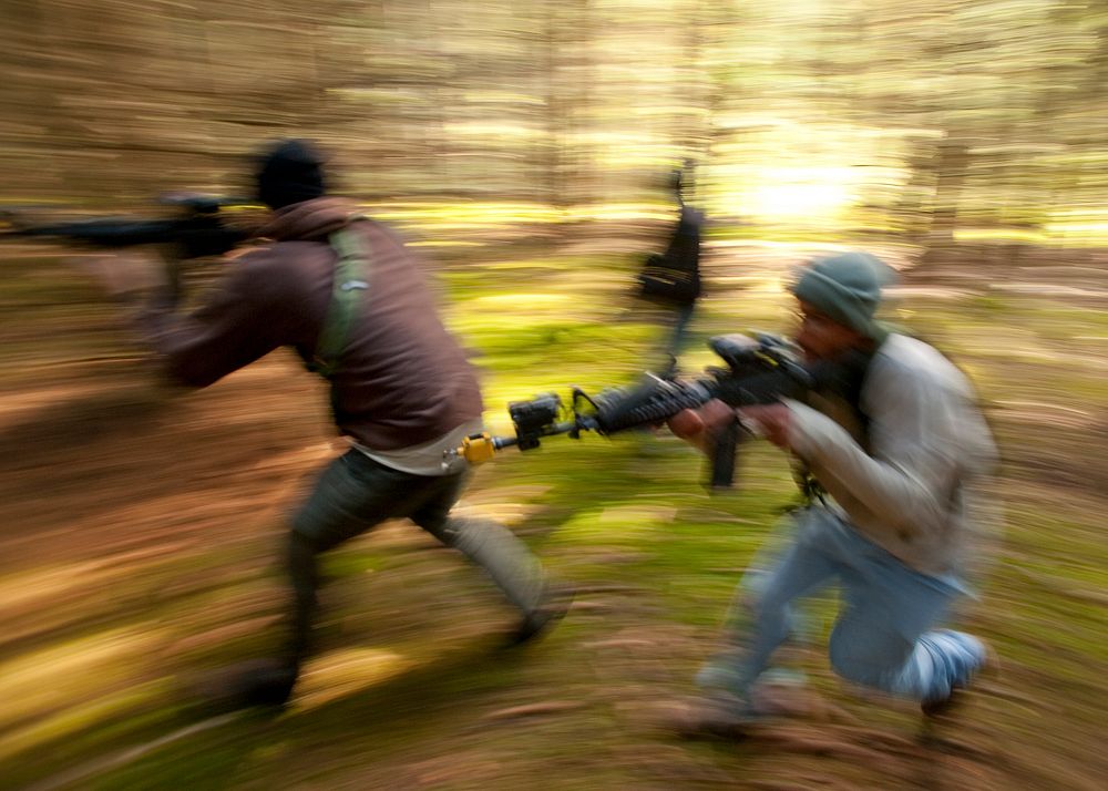 Soldiers run through the woods towards a 173rd Airborne Brigade Combat Team's observation post. Original public domain image…