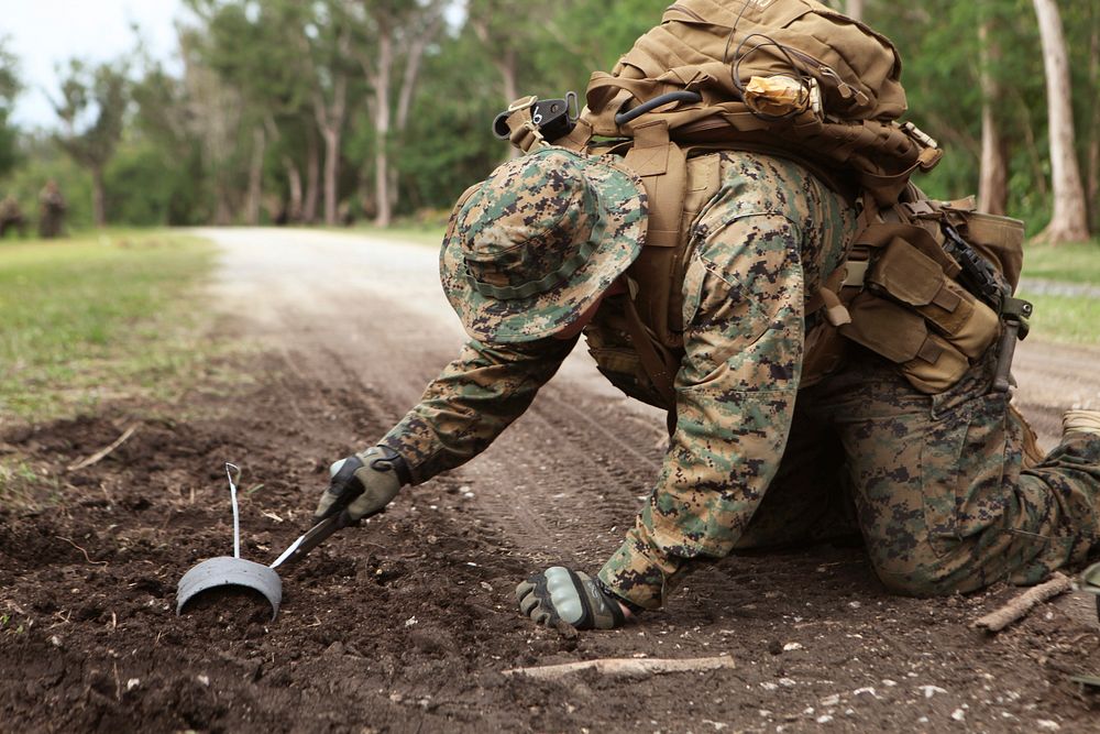 Careful. An explosive ordinance disposal Marine with Company A, Battalion Landing Team 1st Battalion, 4th Marines, 31st…