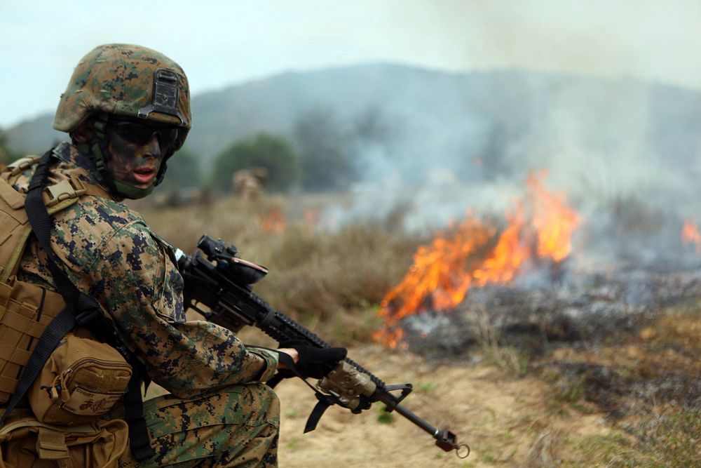 A U.S. Marine assigned to Battalion Landing Team, 1st Battalion, 4th Marines, 31st Marine Expeditionary Unit, provides…